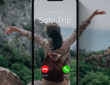 A woman sits on a rock facing a scenic mountain landscape with her arms raised joyfully. Overlaid on the image is a smartphone screen showing an incoming call from "Solo Trip," with options to decline or accept. She wears a green cap, long-sleeve shirt, and a brown backpack, symbolizing the excitement of solo travel and adventure.