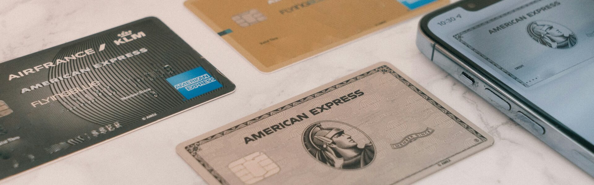 the boujee duck American Express credit cards on marble surface