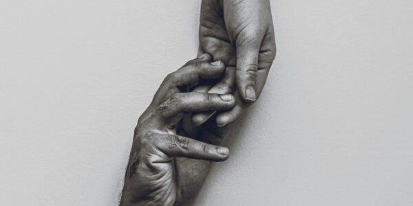the boujee duck Two hands reaching toward each other in black and white